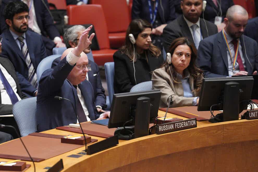 Russian Ambassador to the United Nations Vasily Nebenzya raises his hand against a U.N. Security Council vote on a draft resolution sanctioning Russia’s planned annexation of war-occupied Ukraine territory, Friday Sept. 30, 2022 at U.N. headquarters. (AP Photo/Bebeto Matthews)