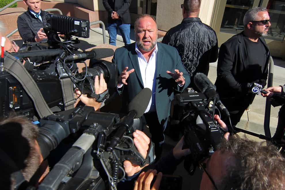 Infowars host Alex Jones speaks to the media outside Connecticut Superior Court during his Sandy Hook defamation damages trial in Waterbury, Conn., Friday, Sept. 23, 2022 (Christian Abraham/Hearst Connecticut Media via AP/PA)