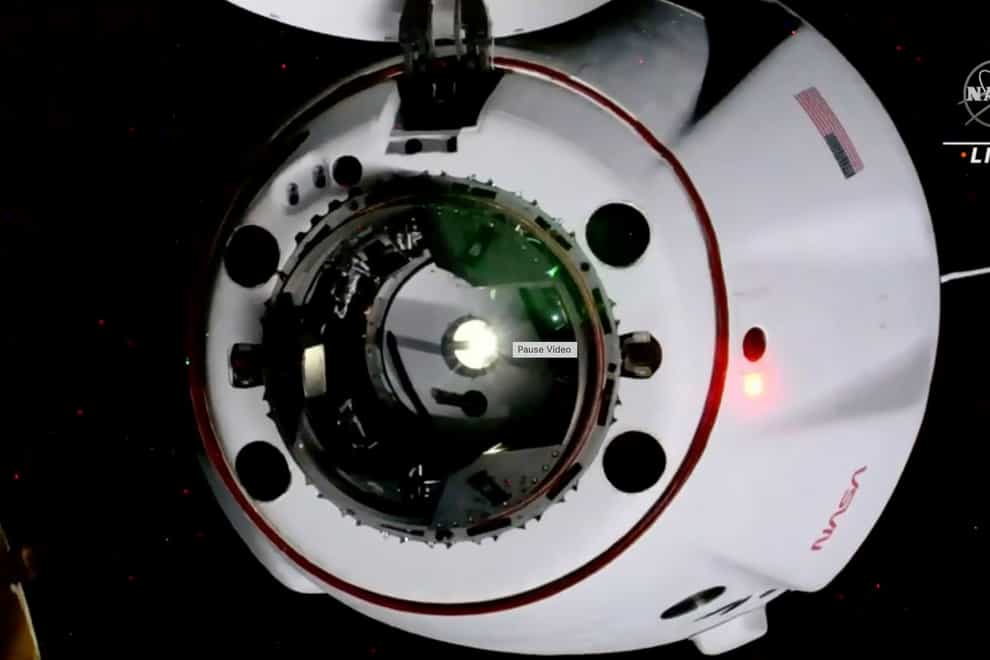 In this image from video made available by NASA, a SpaceX Crew Dragon capsule approaches the International Space Station on Thursday, Oct. 6, 2022. The crew of four includes the first Russian to launch from the U.S., in 20 years and the first Native American woman to orbit the Earth (NASA via AP/PA)