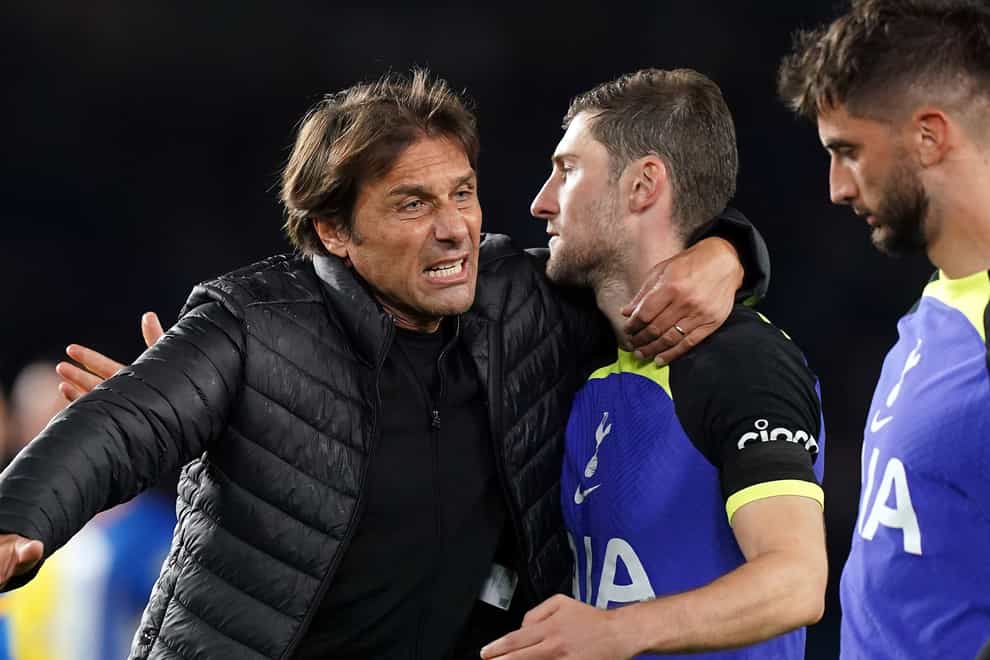 Antonio Conte (left) celebrated with Ben Davies after Tottenham’s victory at Brighton (Gareth Fuller/PA)