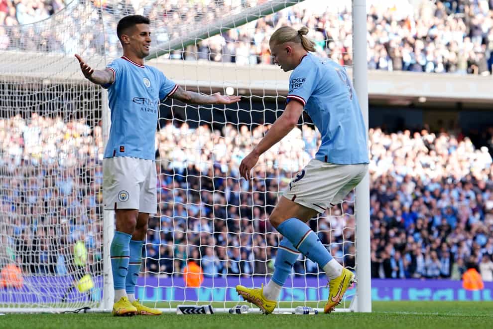 Joao Cancelo (left) and Erling Haaland (right) both scored as Manchester City brushed Southampton aside (Martin Rickett/PA)