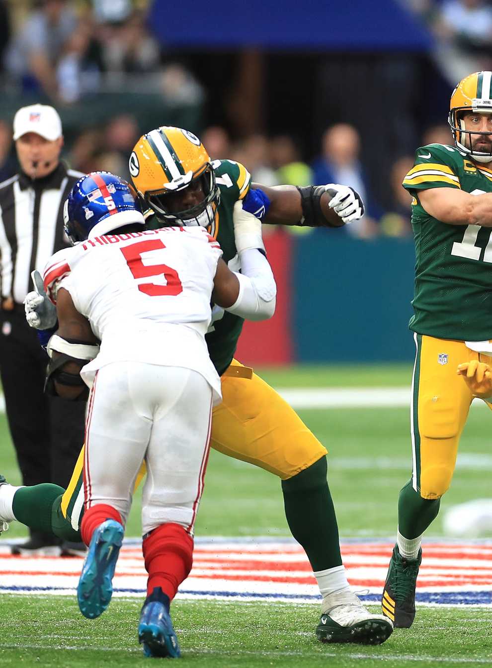 Aaron Rodgers, centre, and Green Bay were beaten in London (Bradley Collyer/PA)