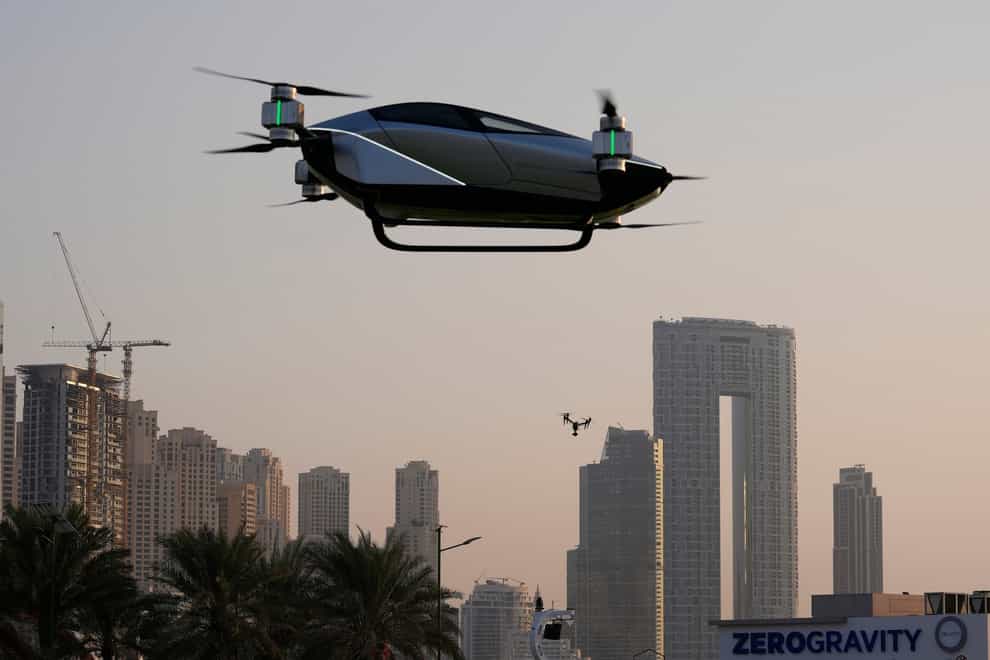 An electric flying taxi is tested in Dubai (Kamran Jebreili/AP)