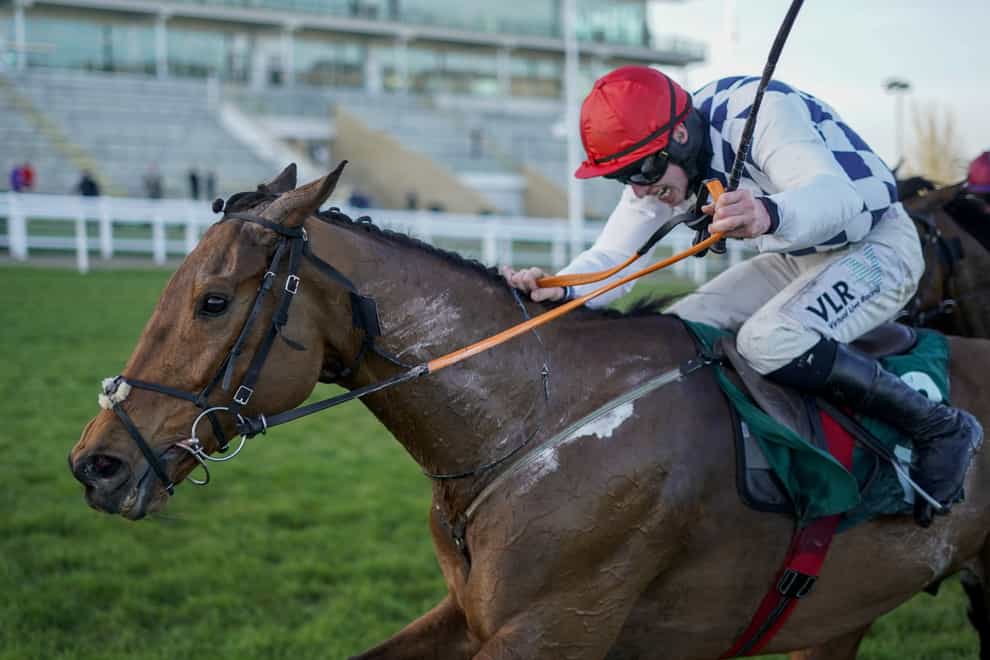 Jack Kennedy riding Galvin (red cap) clear the last to win The Sam Vestey National Hunt Challenge Cup Novices’ Chase during day one of the Cheltenham Festival at Cheltenham Racecourse (Alan Crowhurst/PA)