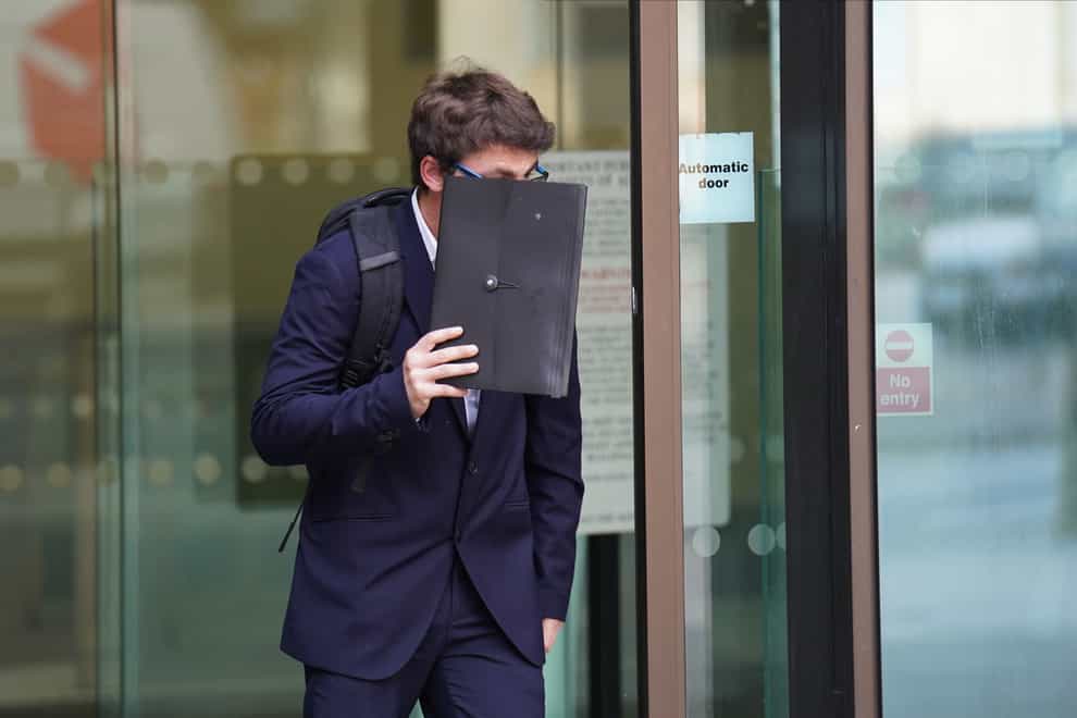Daniel Brydges covers his face as he leaves Westminster Magistrates’ Court (James Manning/PA)