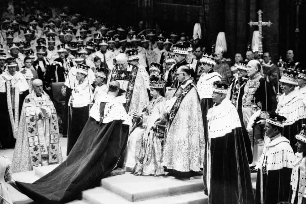 The Duke of Norfolk, the Earl Marshall, paying homage to Queen Elizabeth after her coronation at Westminster Abbey in 1953 (PA)