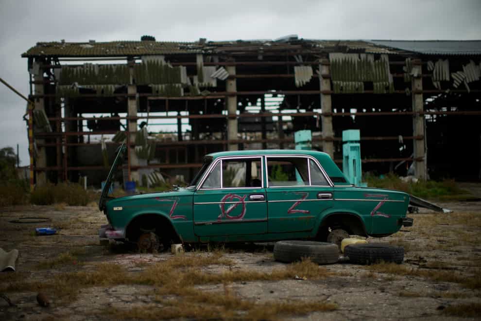 An abandoned car lies on the ground in a heavily damaged grain factory where Russians forces gathered destroyed vehicles at the recaptured town of Lyman (AP)