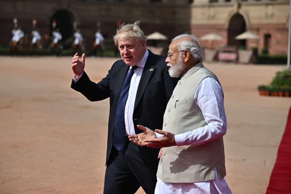 Narendra Modi (right) with Boris Johnson on his visit to India last April (Ben Stansall/PA)