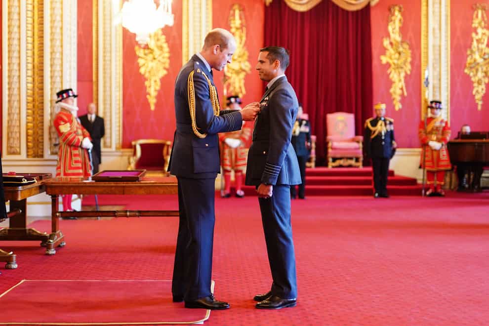 Group Captain Kevin Latchman, Royal Air Force, is decorated with the Air Force Cross by the Prince of Wales at Buckingham Palace (Aaron Chown/PA)
