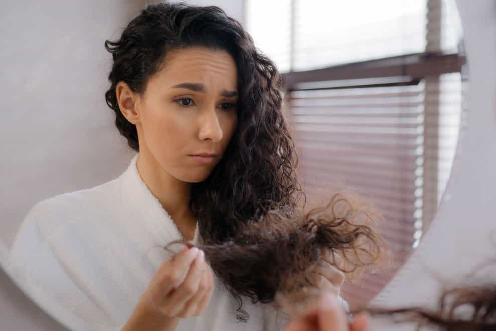 Dry and frizzy locks could be a sign of hair damage (Alamy/PA)
