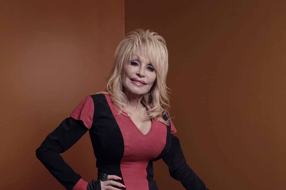 Dolly Parton poses for a picture before the Carnegie Medal of Philanthropy ceremony (Andres Kudacki/AP)