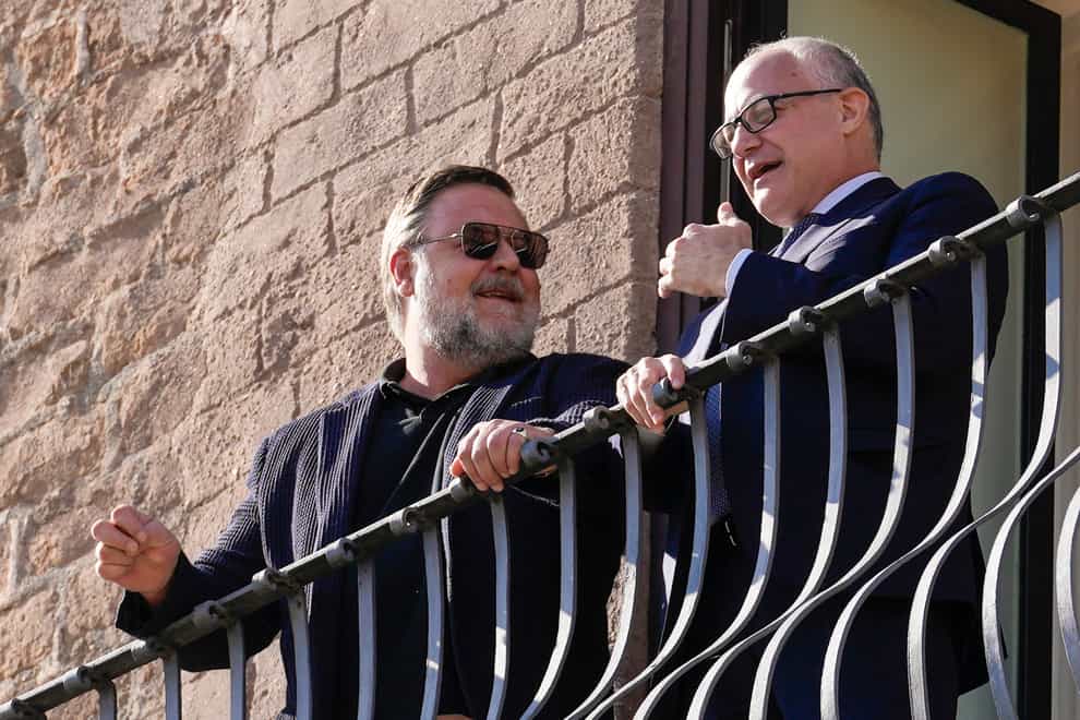 Actor Russell Crowe, left, and Rome’s mayor Roberto Gualtieri talk on the terrace of City Hall (Andrew Medichini/AP)
