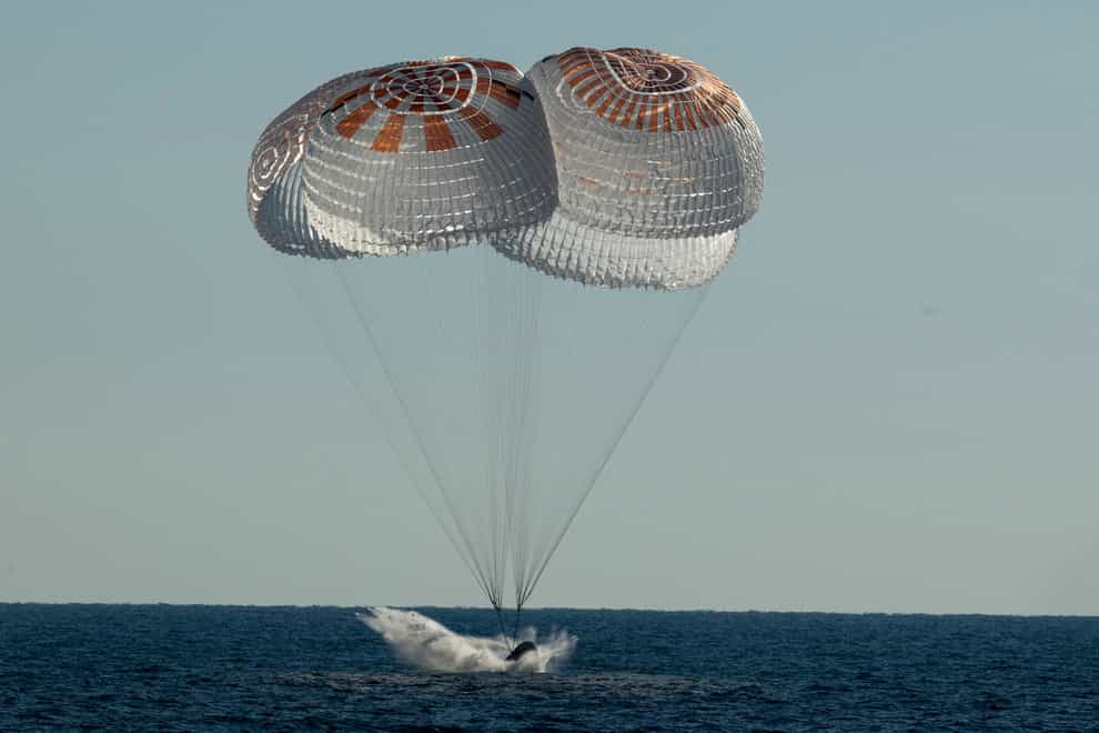 The capsule splashes down in the Atlantic (Bill Ingalls/NASA via AP)