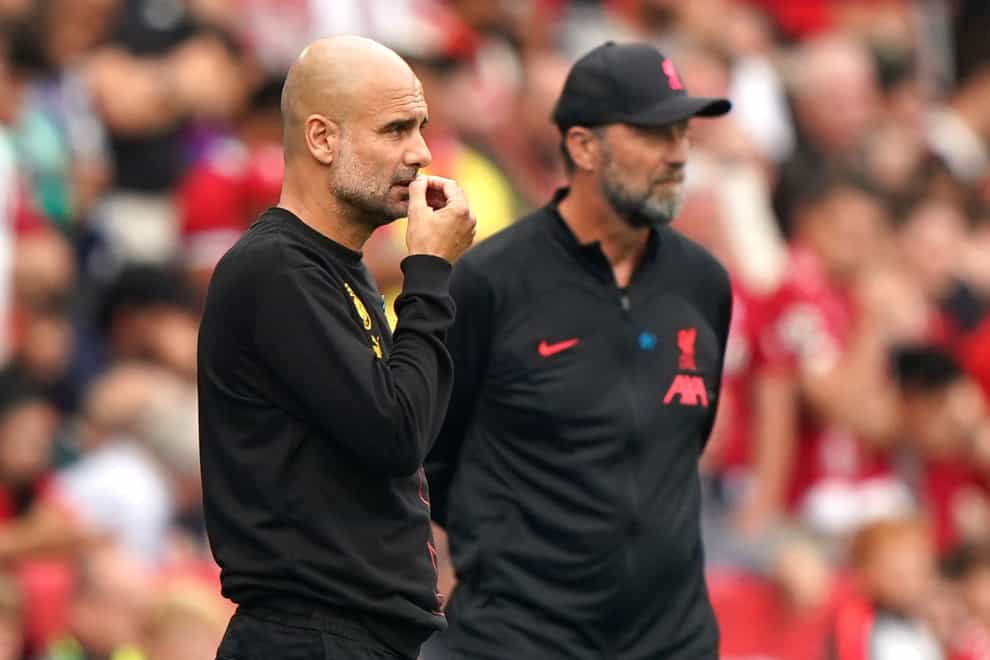 Pep Guardiola, left, is preparing for another battle with Jurgen Klopp (right) and Liverpool (Joe Giddens/PA)
