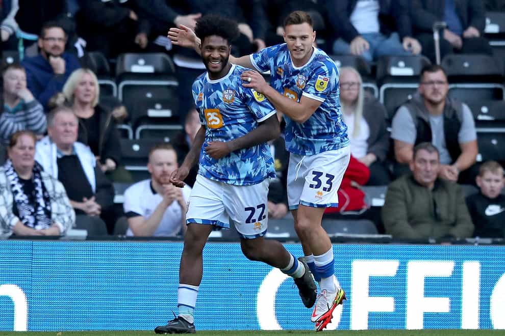Port Vale’s Ellis Harrison (left) celebrates with team-mate Dennis Politic after scoring their side’s first goal of the game from the penalty spot during the Sky Bet League One match at Pride Park Stadium, Derby. Picture date: Saturday October 8, 2022.