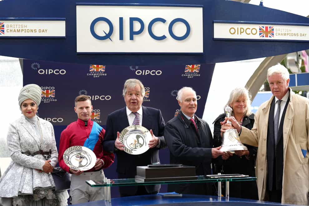Jockey Richard Kingscote (second left), trainer Sir Michael Ronald Stoute and owner James Wigan (right) celebrates horse Bay Bridge wins the Qipco Champion Stakes during the QIPCO British Champions Day at Ascot Racecourse, Berkshire (John Walton/PA)