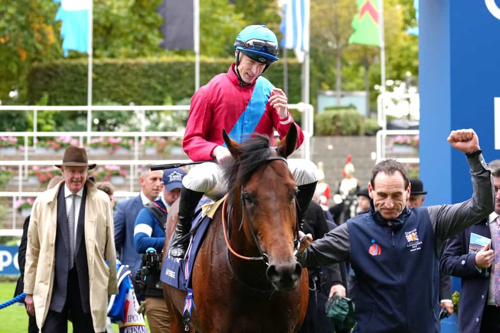 Jockey Richard Kingscote celebrates with horse Bay Bridge after winning the Qipco Champion Stakes during the QIPCO British Champions Day at Ascot Racecourse, Berkshire. Picture date: Saturday October 15, 2022.