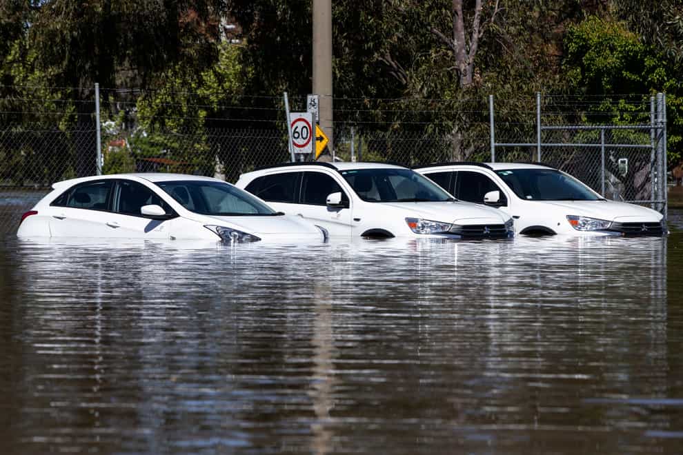 A trio of cars are stuck in floodwaters in Shepparton, Australia (AAP via AP)