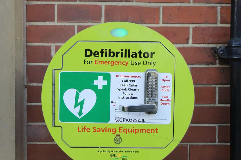 An emergency defibrillator on a wall (Chris Radburn/PA)