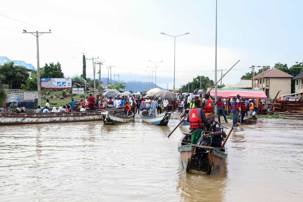 People stranded due to floods following several days of downpours In Kogi Nigeria (AP)