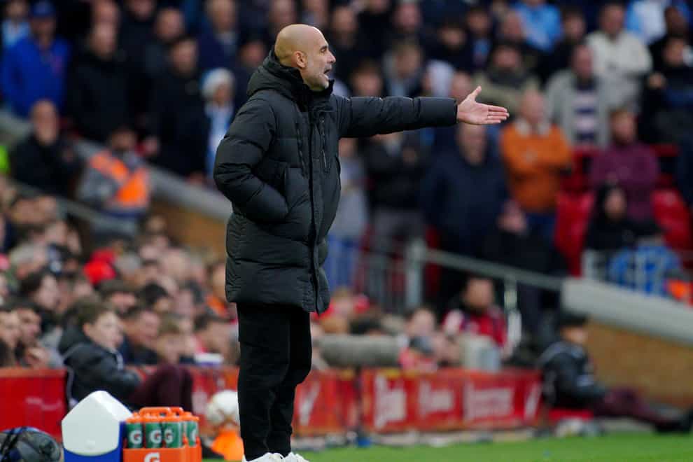Merseyside Police are working with Manchester City to investigate claims coins were thrown at manager Pep Guardiola (Peter Byrne/PA)