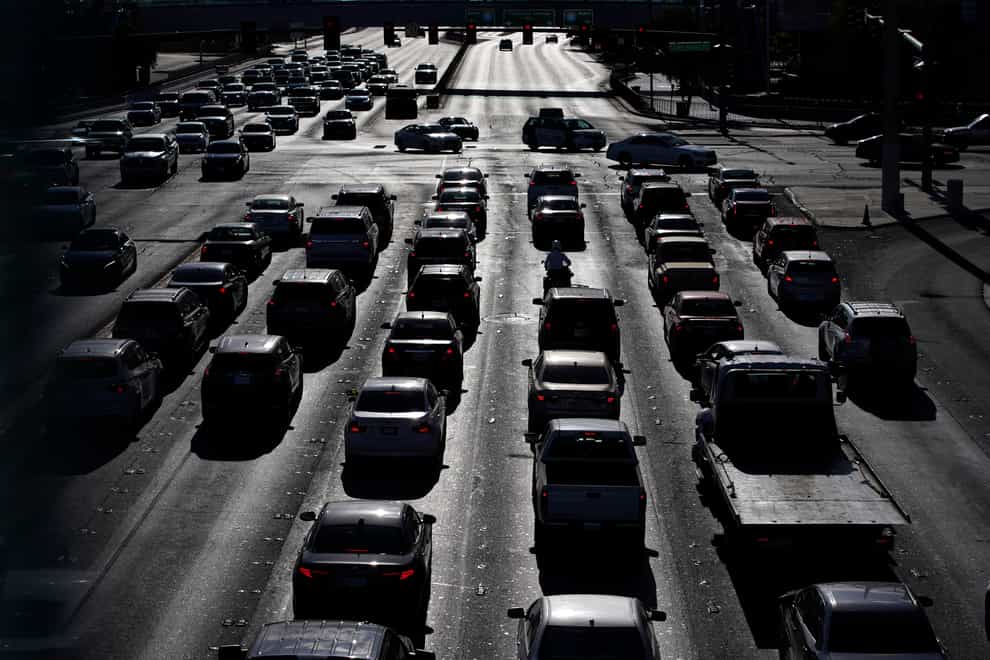 Cars wait at a red light during rush hour on the Las Vegas Strip (John Locher/AP)
