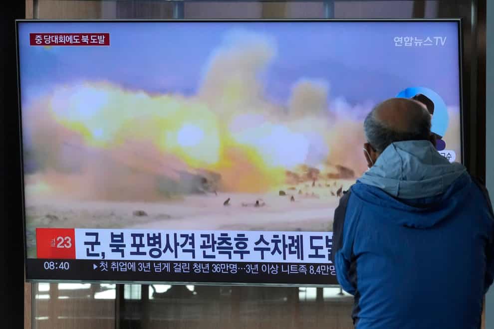 A TV screen shows a file image of North Korea’s military exercise during a news programme at the Seoul Railway Station (AP)