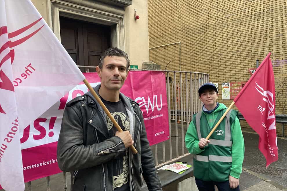 Tom Coles-Rogers (left) and Charlie Jones outside Brighton Delivery Office during a Communication Workers Union strike action for Postal workers, Openreach engineers and call centre staff. Picture date: Thursday October 20, 2022 (Katie Boyden/PA)