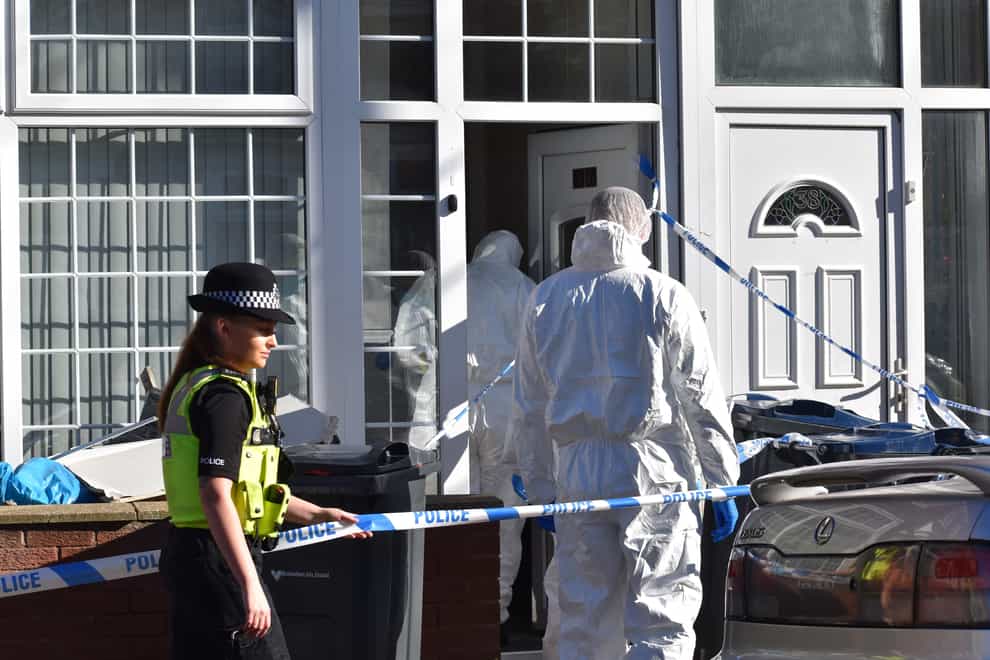 Forensic officers in Dovey Road in Sparkhill, Birmingham (PA)