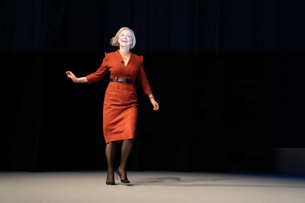 Liz Truss arriving on stage at the Conservative party conference in early October 2022 (Stefan Rousseau/PA)
