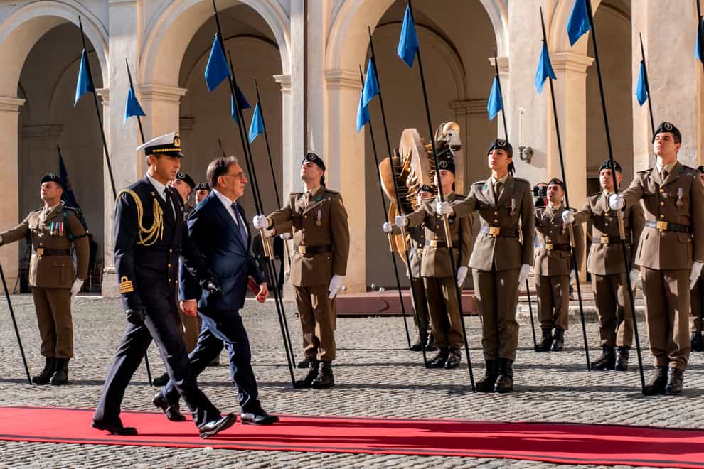President of the Italian Senate Ignazio La Russa, second from left, arrives at the Quirinale Presidential Palace to meet Italian President Sergio Mattarella (LaPresse via AP)