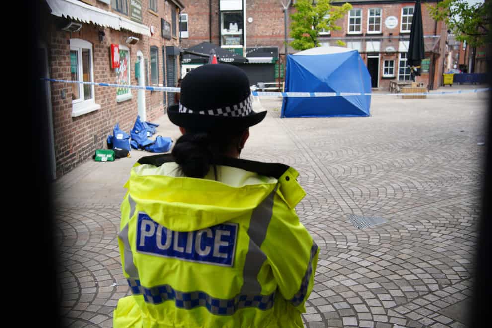 A police tent at the scene on Railway Street in Altrincham where 31-year-old Rico Burton was killed (Peter Byrne/PA)
