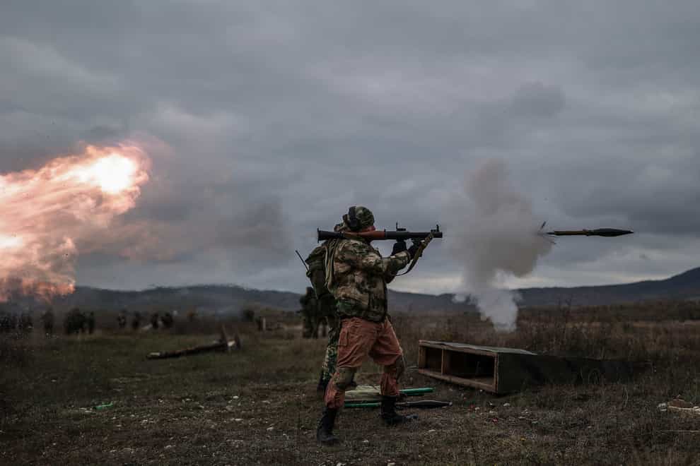 A recruit fires a Russian man-portable missile during a military training at a firing range in the Krasnodar region in southern Russia (AP)