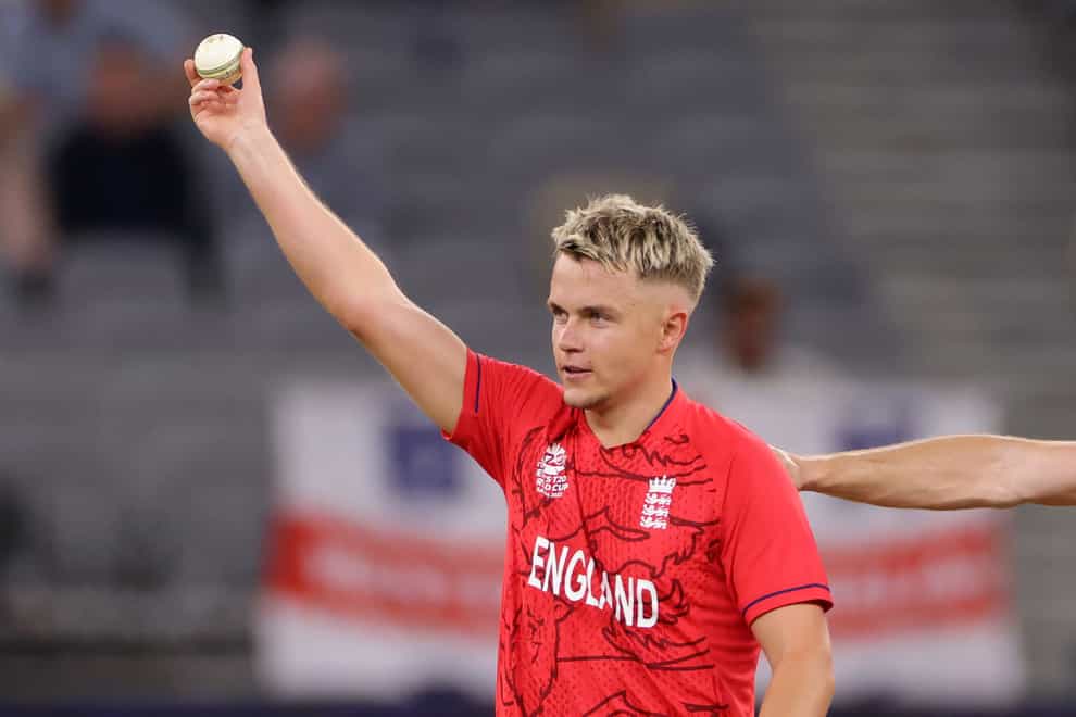 Sam Curran holds the ball aloft after taking five for 10 in England’s five-wicket T29 World Cup win over Afghanistan in Perth (PA Wire/PA Images).