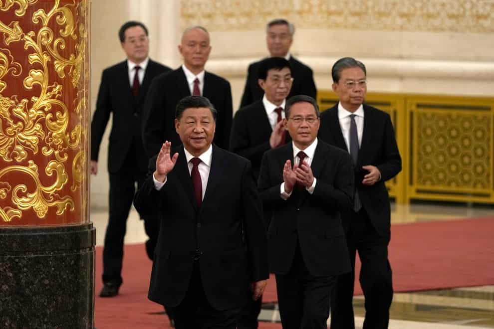 President Xi Jinping (front, centre) increased his dominance over China as he was named to another term as head of the ruling Communist Party in a break with tradition (Ng Han Guan/AP)