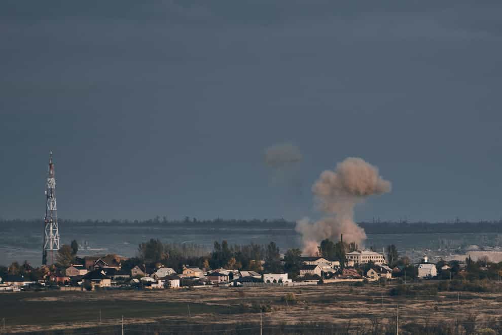 A plume of smoke rises after Russian shelling in Bakhmut, in Donetsk region (LIBKOS/AP)