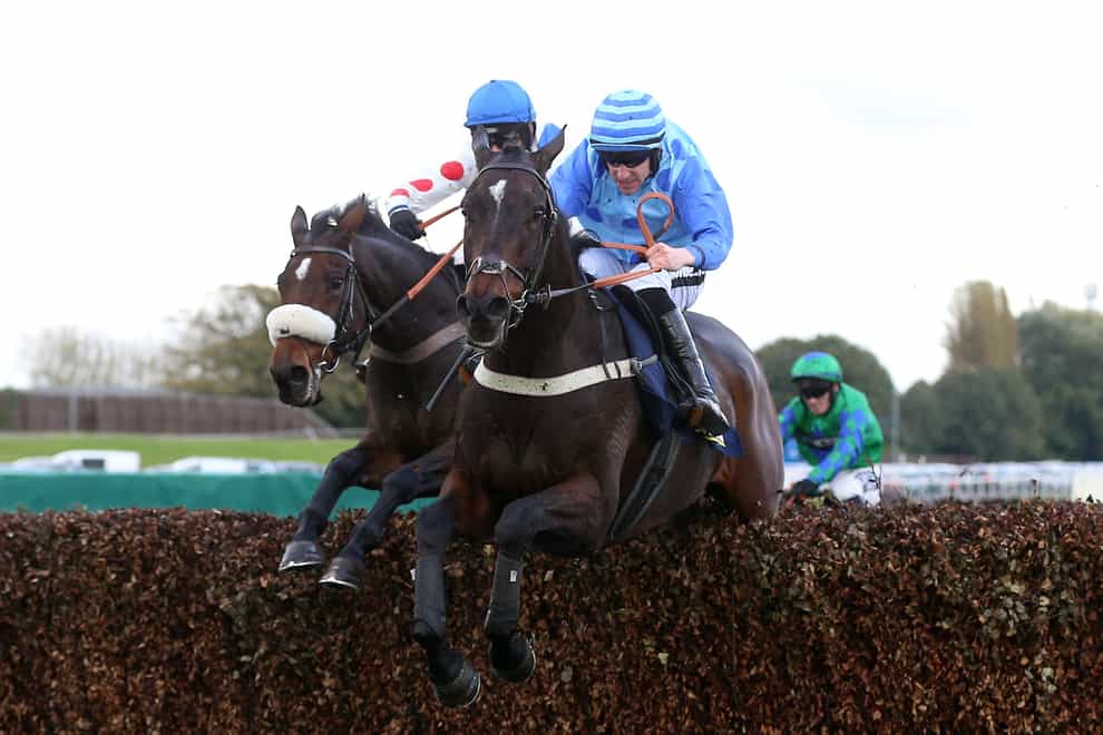 Riders Onthe Storm ridden by Brian Hughes (right) go on to win The Jewson St Helens Old Roan Limited Handicap Chase during Jewson Halloween Family Day at Aintree Racecourse (Nigel French/PA)