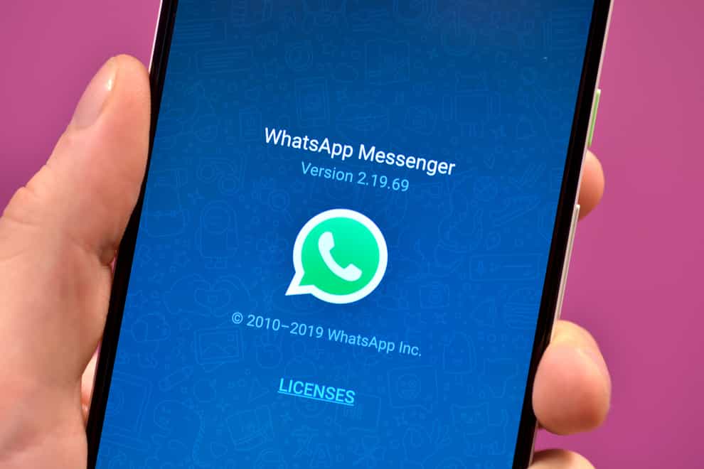 Stock photo of the WhatsApp app icon on a smartphone.
