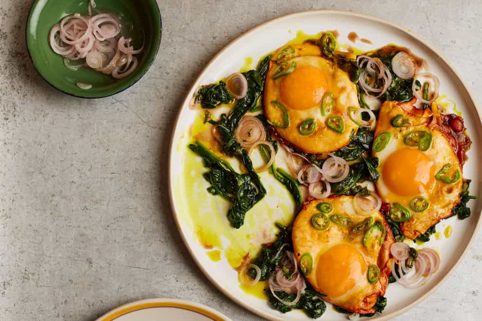 Turmeric fried eggs with tamarind dressing from Ottolenghi Test Kitchen: Extra Good Things (Elena Heatherwick/PA)