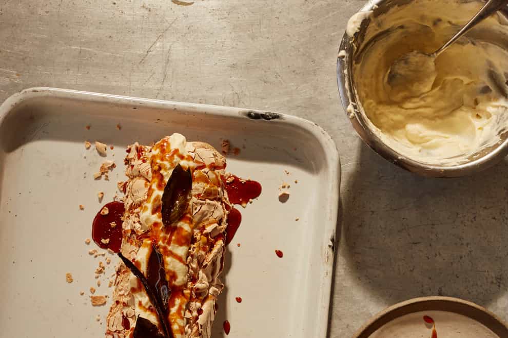 Brown sugar meringue roulade with burnt honey apples from Ottolenghi Test Kitchen: Extra Good Things (Elena Heatherwick/PA)
