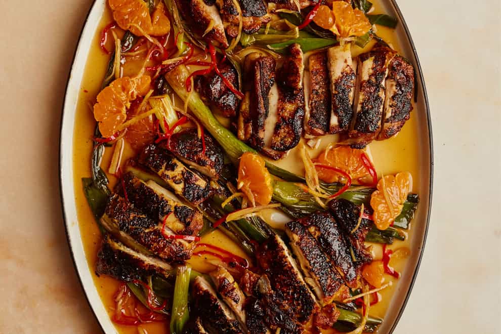 Blackened chicken with caramel and clementine dressing from Ottolenghi Test Kitchen: Extra Good Things (Elena Heatherwick/PA)