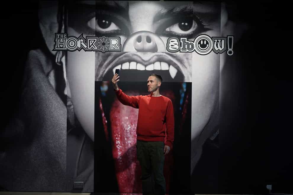 A visitor taking a selfie during the preview for The Horror Show! exhibition at Somerset House, London (Yui Mok/PA)