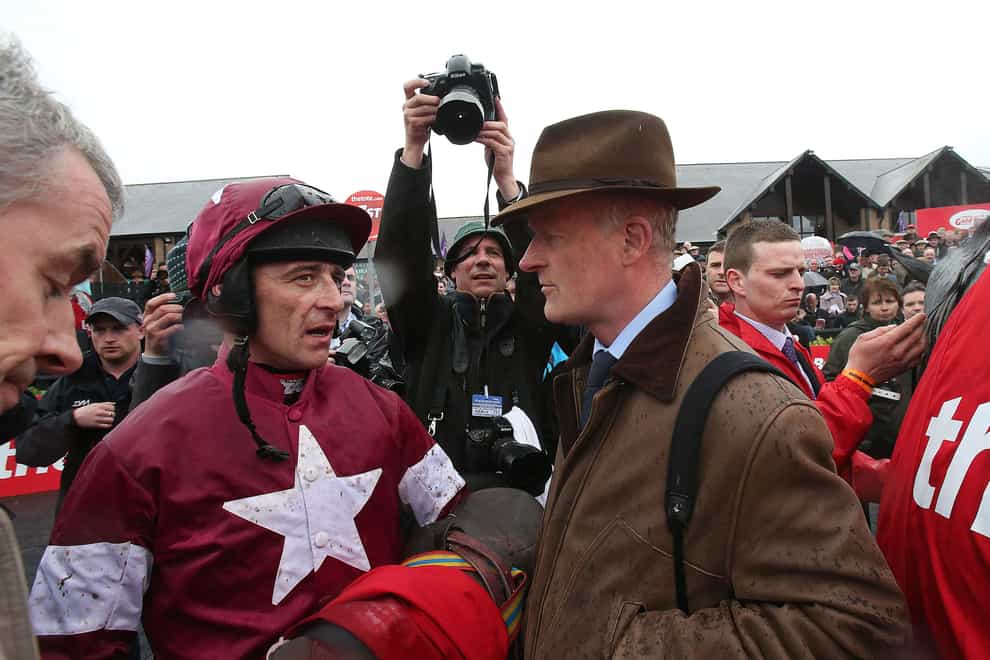 Davy Russell chats to trainer Willie Mullins (right) after winning the TheTote.com Punchestown Gold Cup Steeplechase on Sir Des Champs during Gold Cup Day at the 2013 Festival at Punchestown Racecourse, Co Kildare, Ireland.