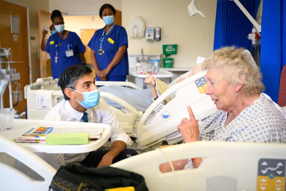 Prime Minister Rishi Sunak speaks to patient Catherine Poole during a visit to Croydon University Hospital, south London (Leon Neal/PA)
