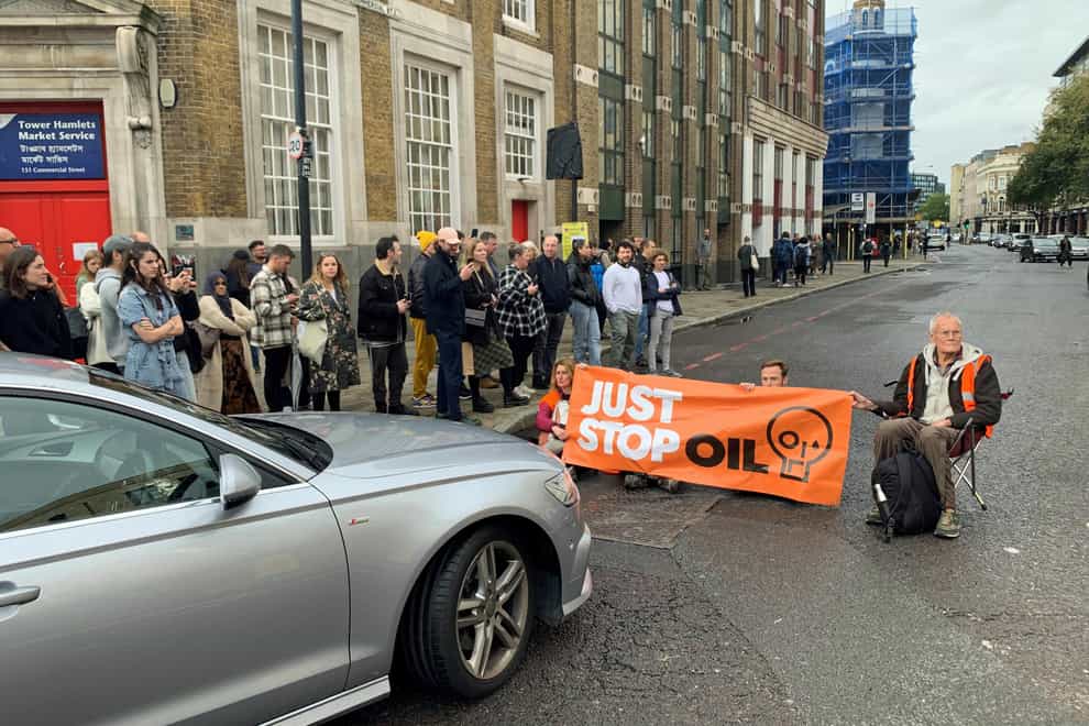 Just Stop Oil activists block Commercial Street in east London (Lucas Cumiskey/PA)