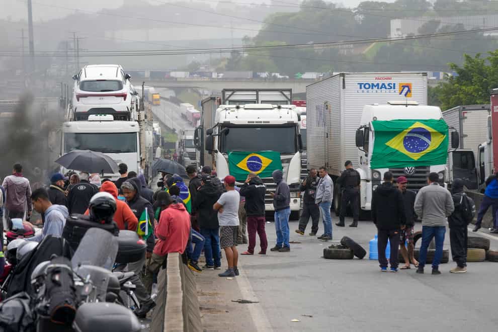 Truckers supportive of President Jair Bolsonaro block a road (Andre Penner/AP)