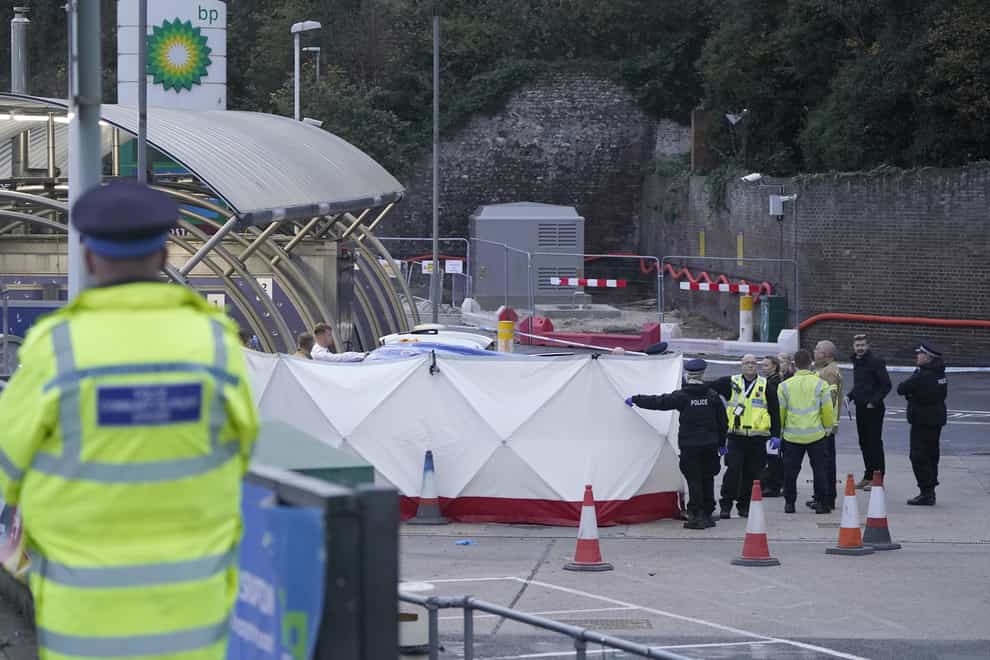 Police officers by a tent around the car allegedly involved in an incident near the migrant processing centre in Dover, Kent. Picture date: Sunday October 30, 2022.