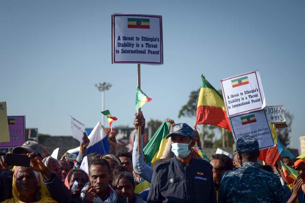 Ethiopians protest against what they say is interference by outsiders in the country’s internal affairs and against the Tigray People’s Liberation Front (TPLF), the party of Tigray’s fugitive leaders, at a rally organised by the city administration in the capital Addis Ababa (AP/PA)