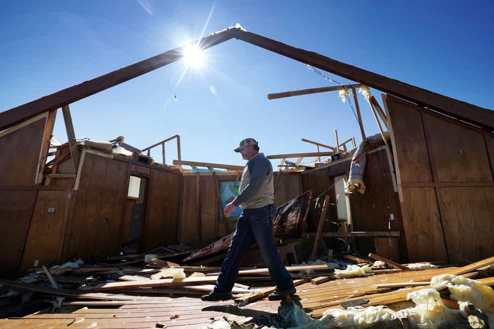 Danny Palmer, a deacon at Trinity Baptist Church in Oklahoma, walks across the destroyed church’s sanctuary (AP)
