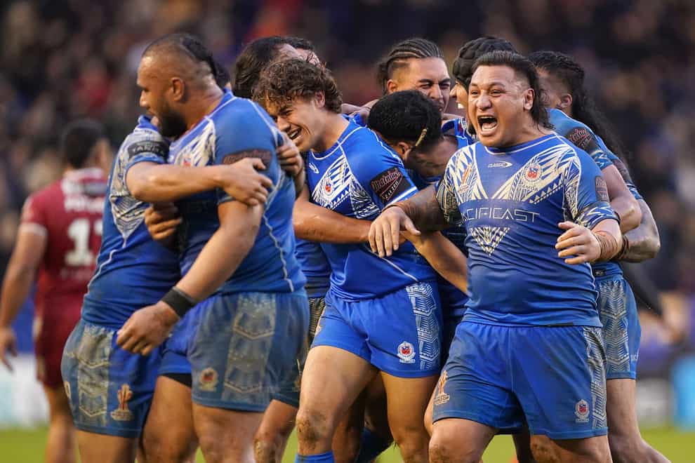 Samoa’s Josh Papali’i celebrates with his teammates after beating Tonga, during the Rugby League World Cup quarter final match at the Halliwell Jones Stadium, Warrington. Picture date: Sunday November 6, 2022.